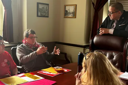 GSEU-1104 member Bradley Hershenson speaks with NY State Senator Gustavo Rivera