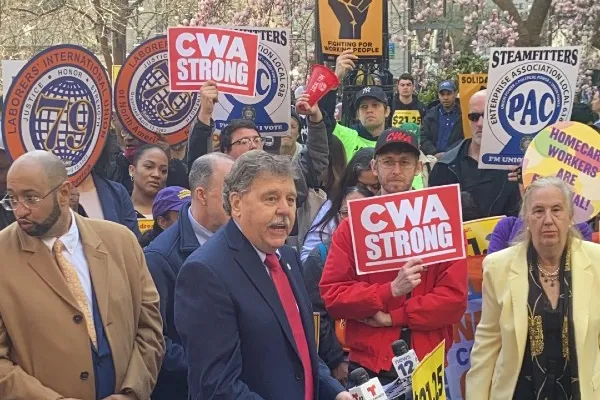 Dennis Trainor speaking at rally for minimum wage increase