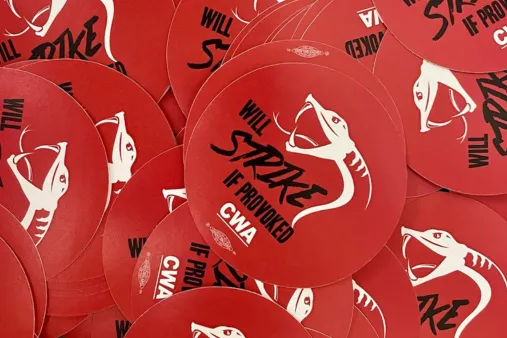 CWA stickers saying "will strike if provoked"
