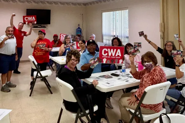 CWA members in NJ writing postcards for Sue Altman