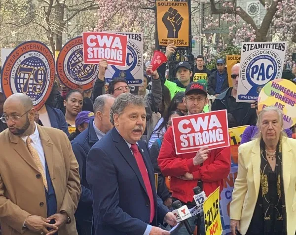 Dennis Trainor speaking at rally for minimum wage increase