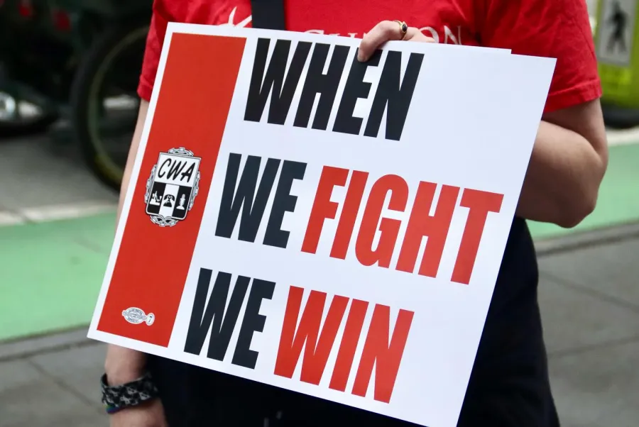 CWA 1123-TCGUnion rally sign saying "When We Fight We Win"