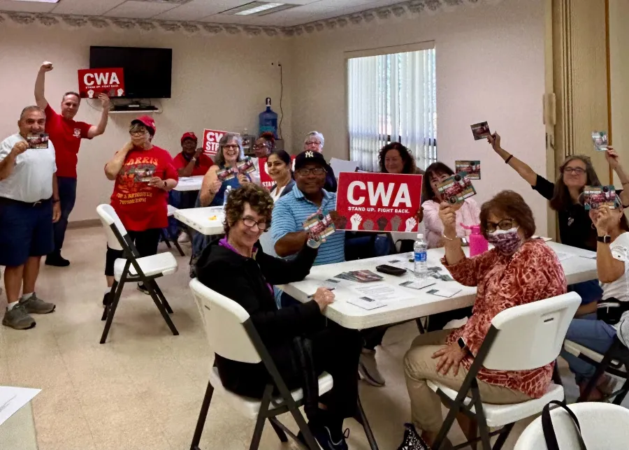 CWA members in NJ writing postcards for Sue Altman